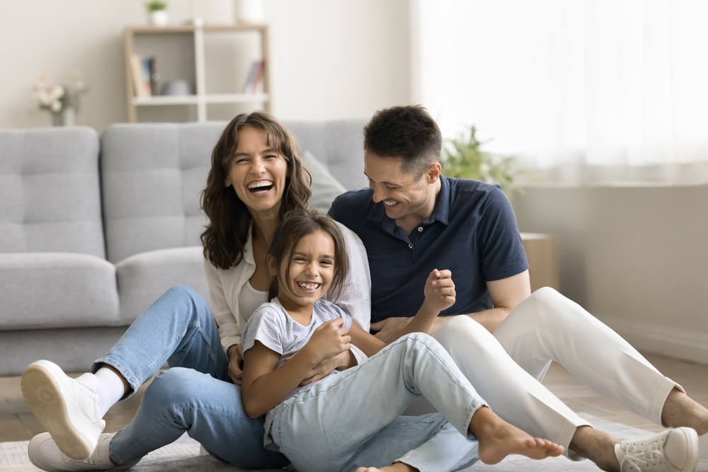 Sweet,Home.,Laughing,Candid,Millennial,Spouses,With,Preteen,Child,Mother