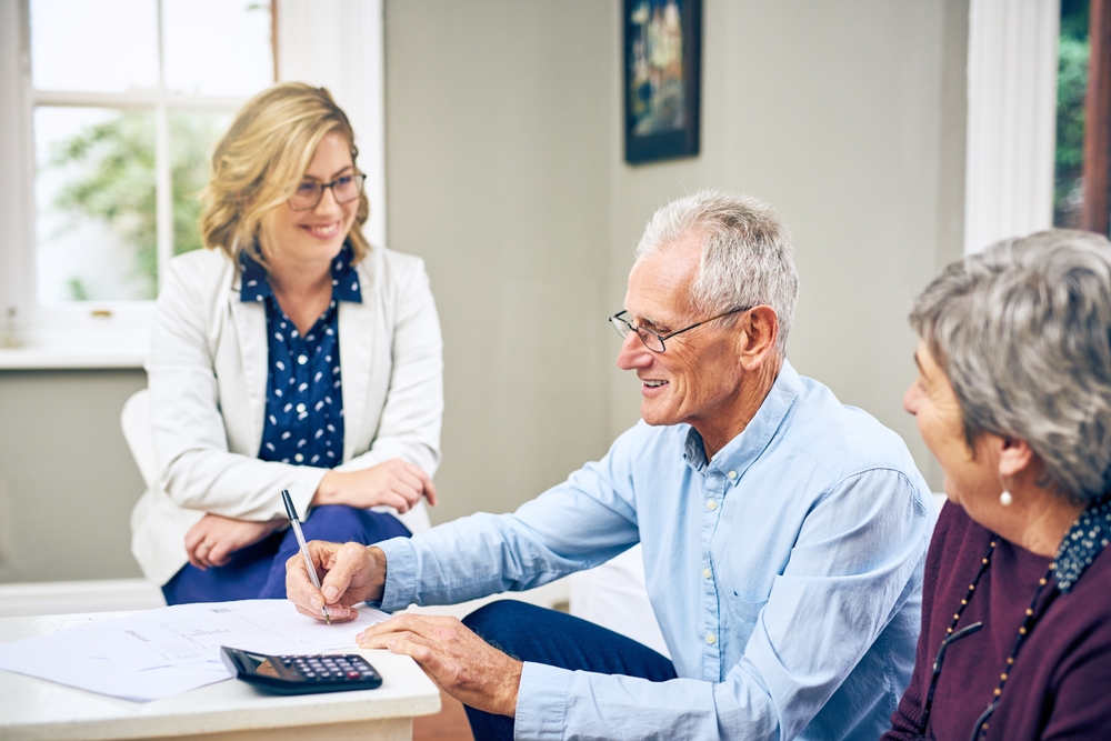 Senior,Couple,,Paperwork,And,Life,Insurance,With,Financial,Planning,,Woman